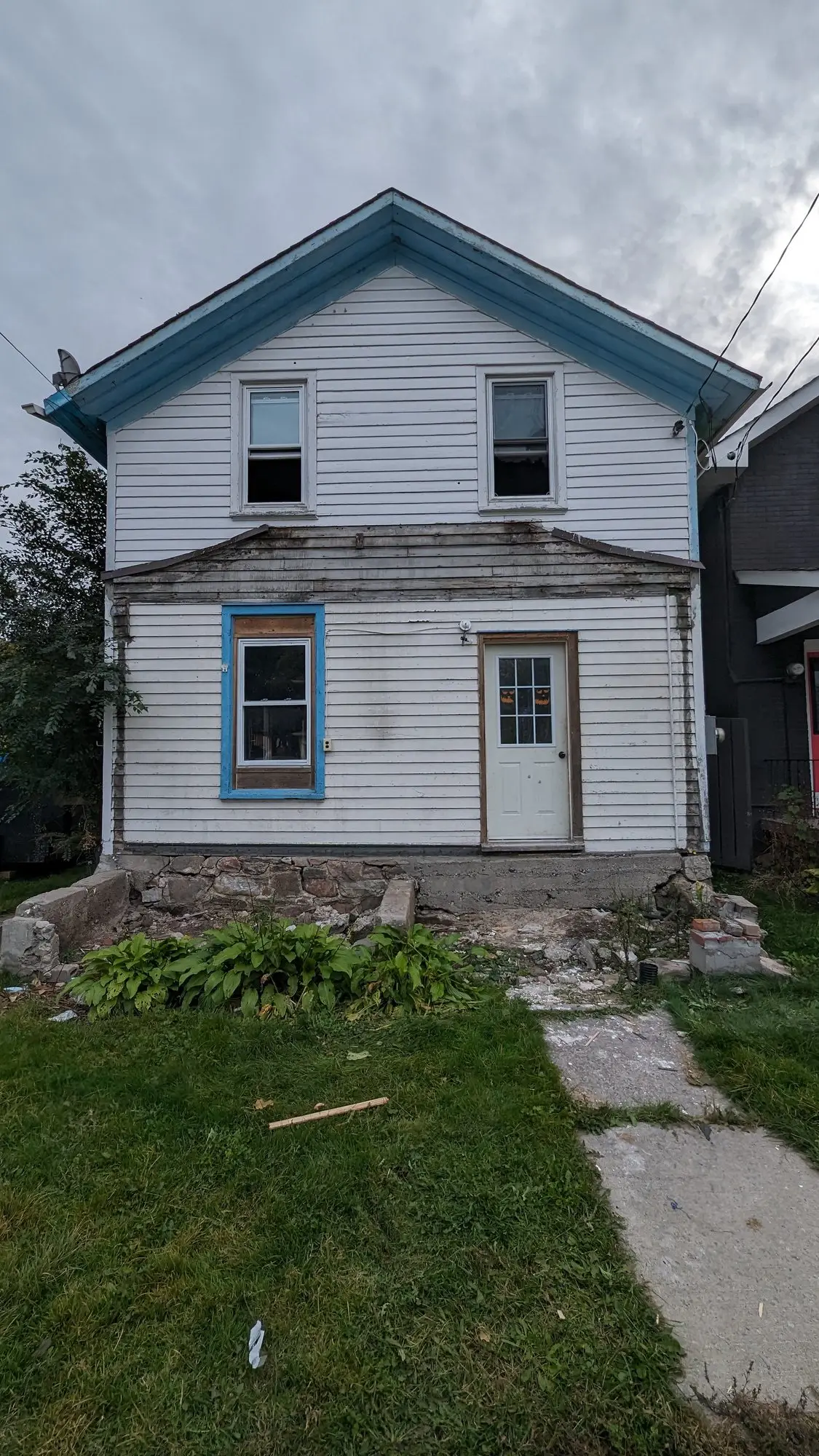 Rear elevation of the century home before work started