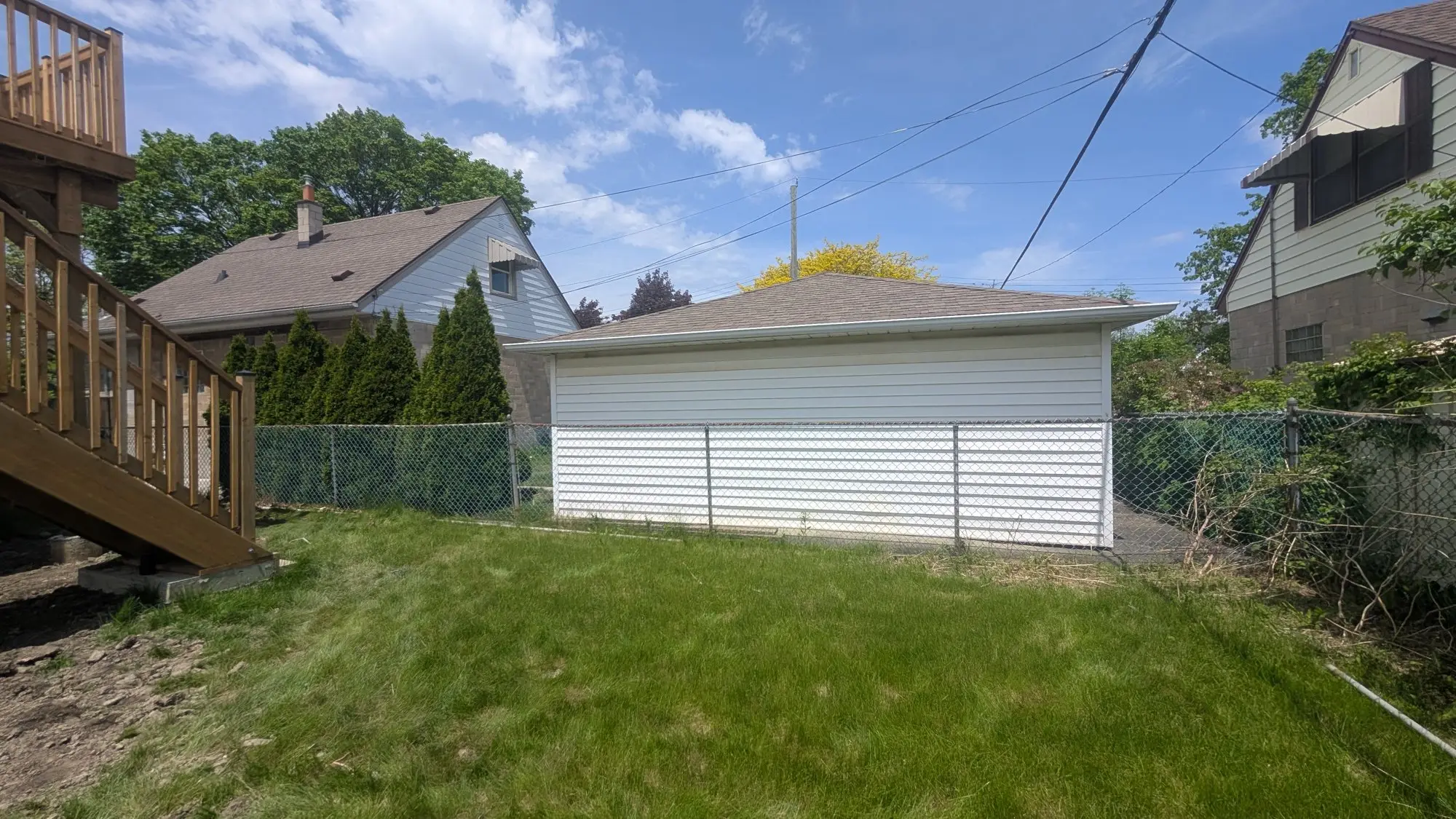 The detached garage before work started — this became the fourth unit