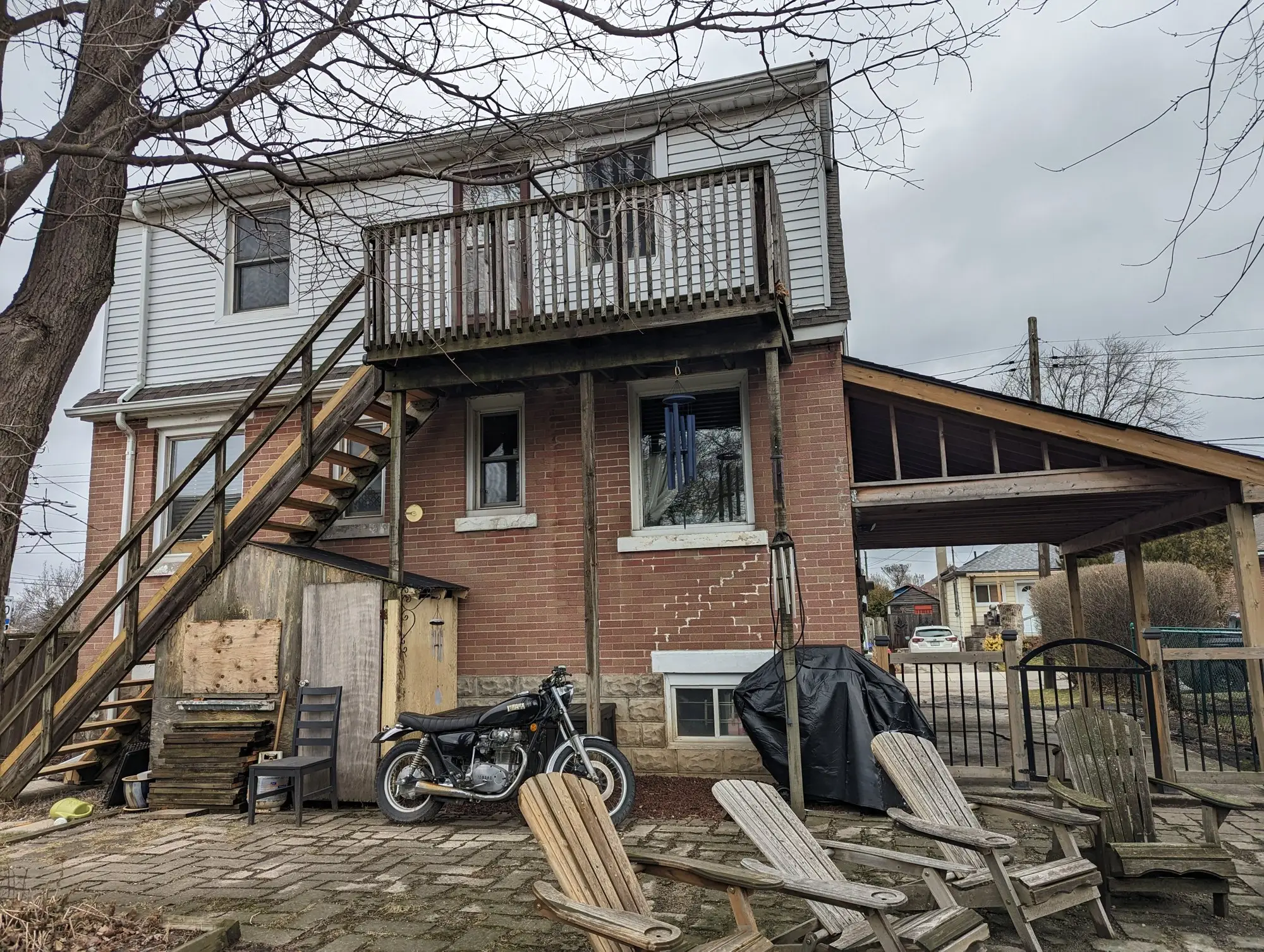 The original exterior wooden staircase at the rear, the only second-floor access