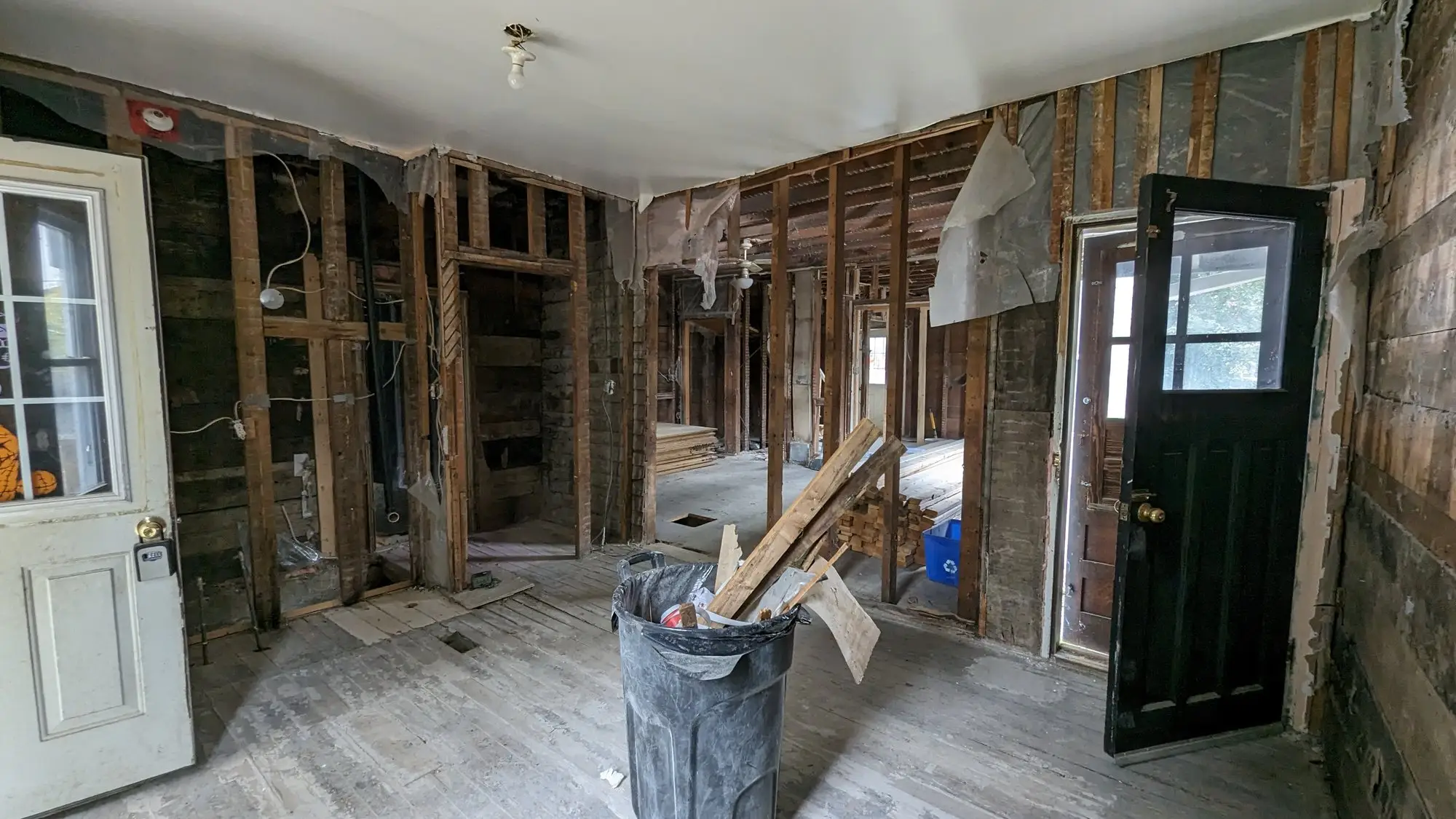 Original interior with the old panel door before demolition