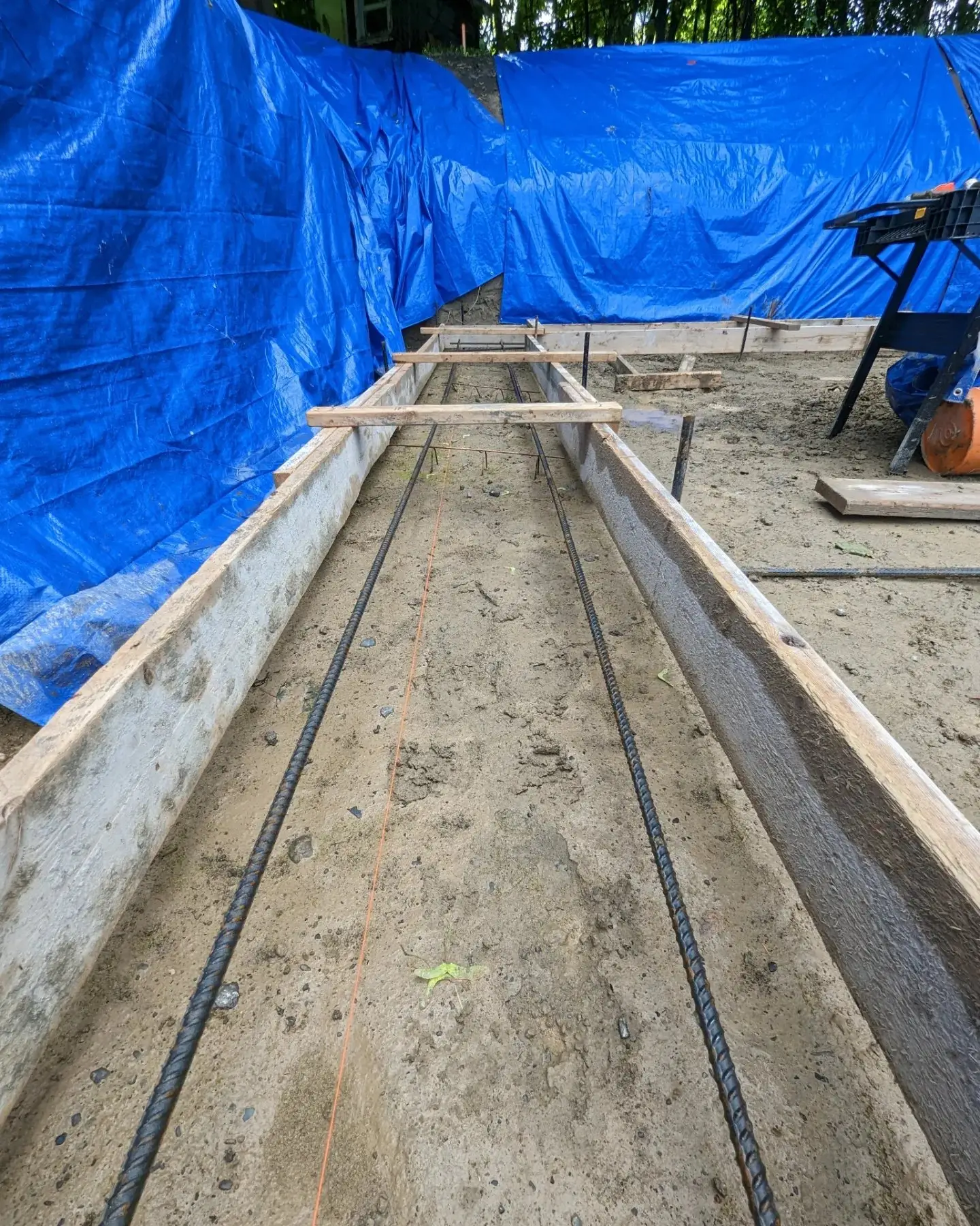 Reinforced foundation forms squared up and braced ready for concrete
