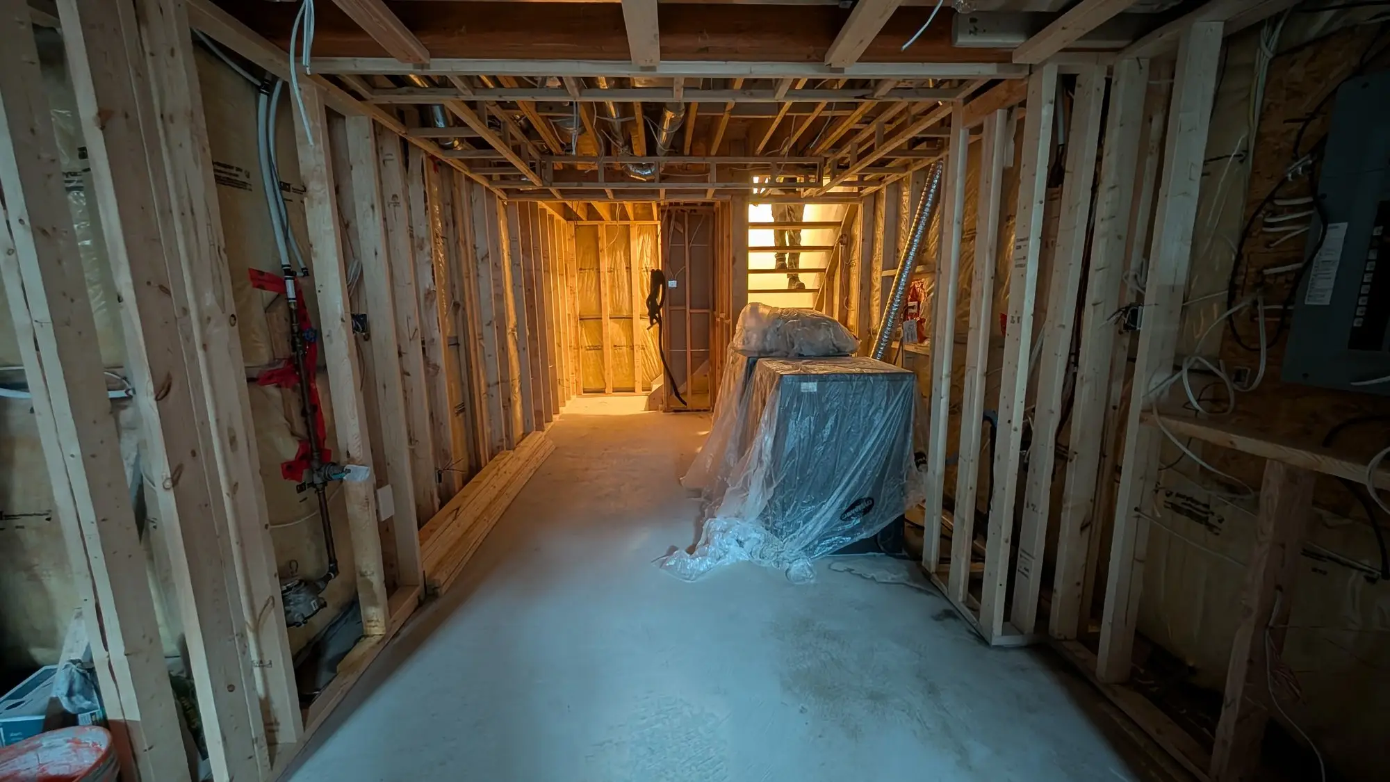 New partition framing forming the basement corridor