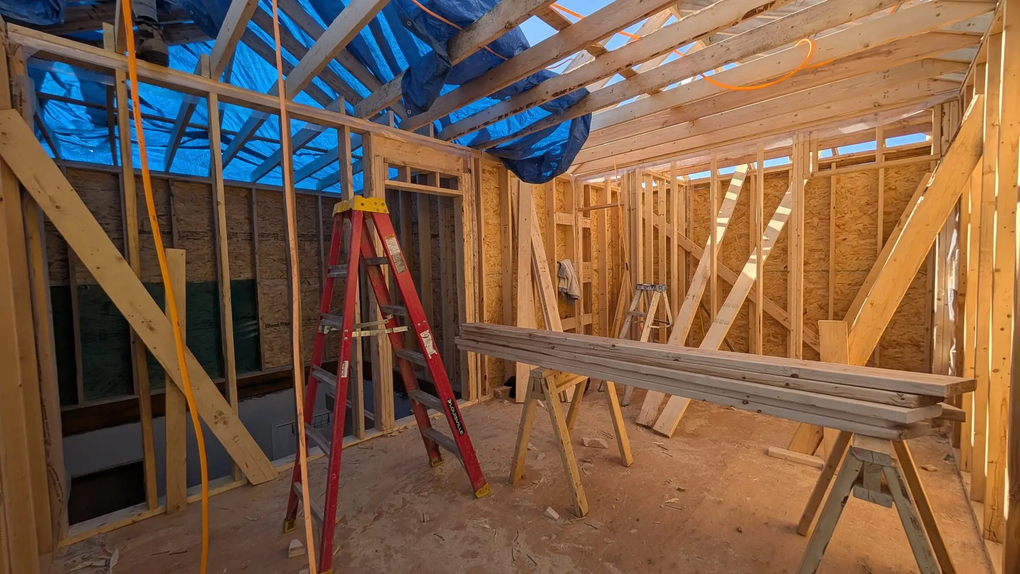 New floor framing set over the original walls