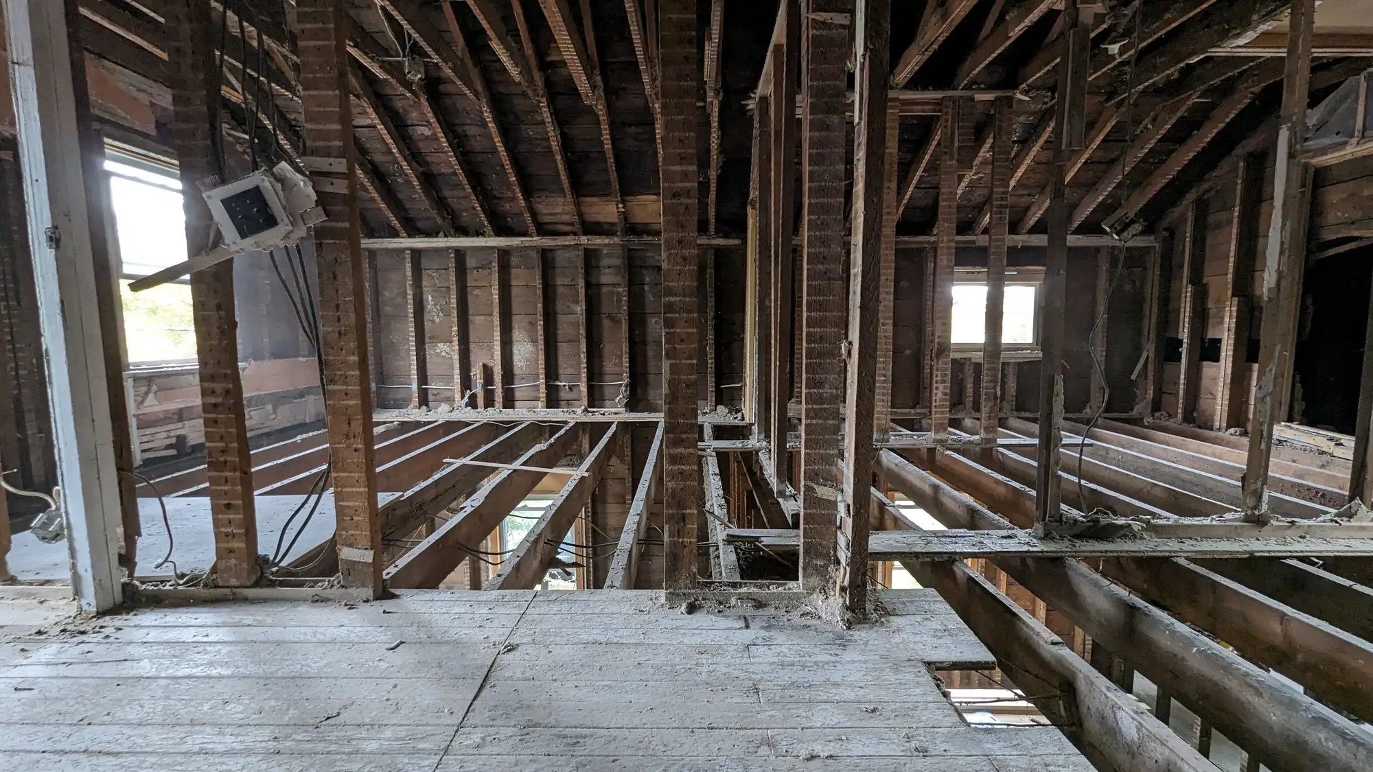 Wide view of the opened floor structure during demolition