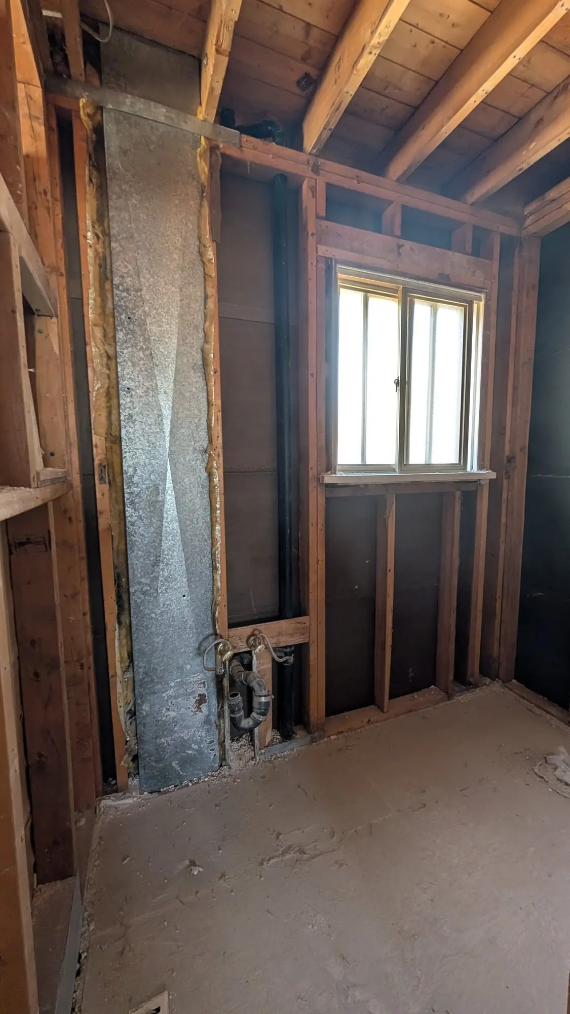 Upper floor stripped back to studs and joists