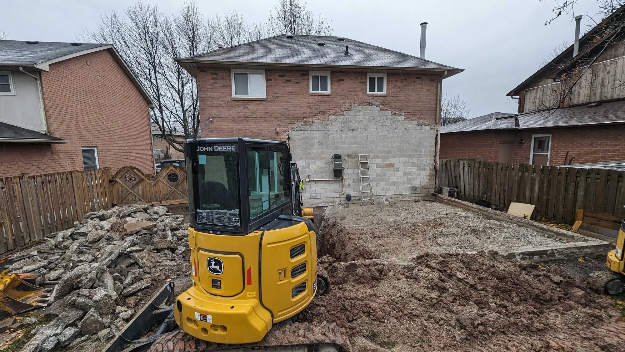 The excavated footprint of the addition, cleared and ready for footings