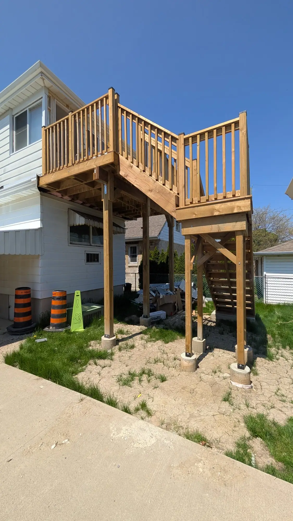 New rear entrance landing and stairs framed to serve the upper unit