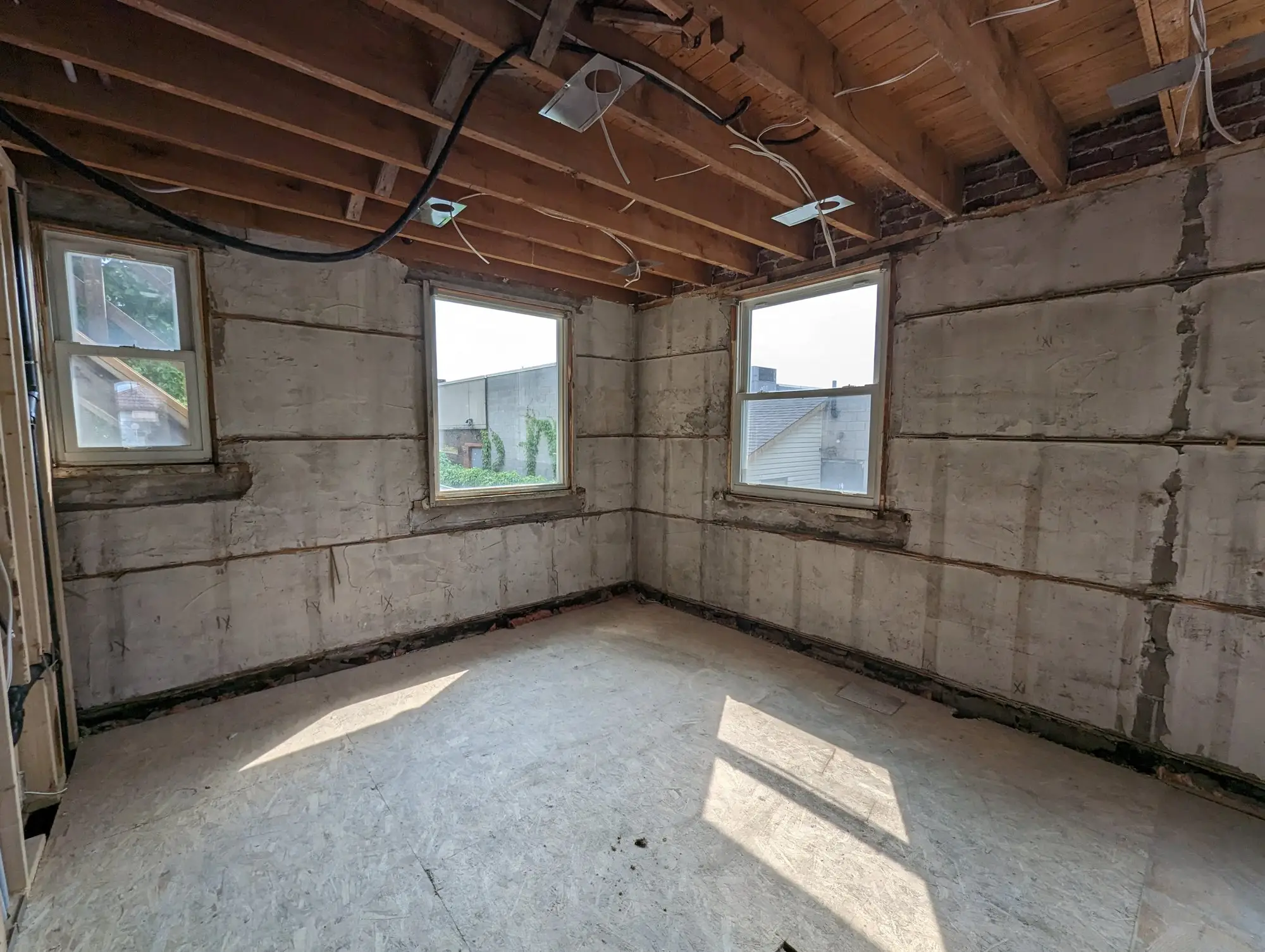 Main floor stripped back to bare masonry and ceiling joists
