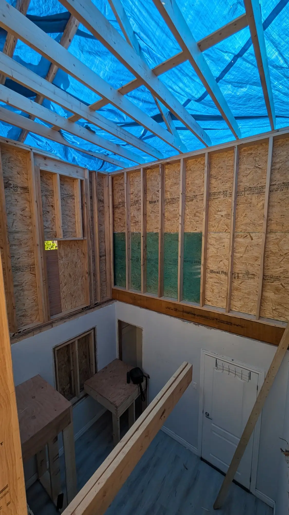 Upper level framed out with the roof structure above