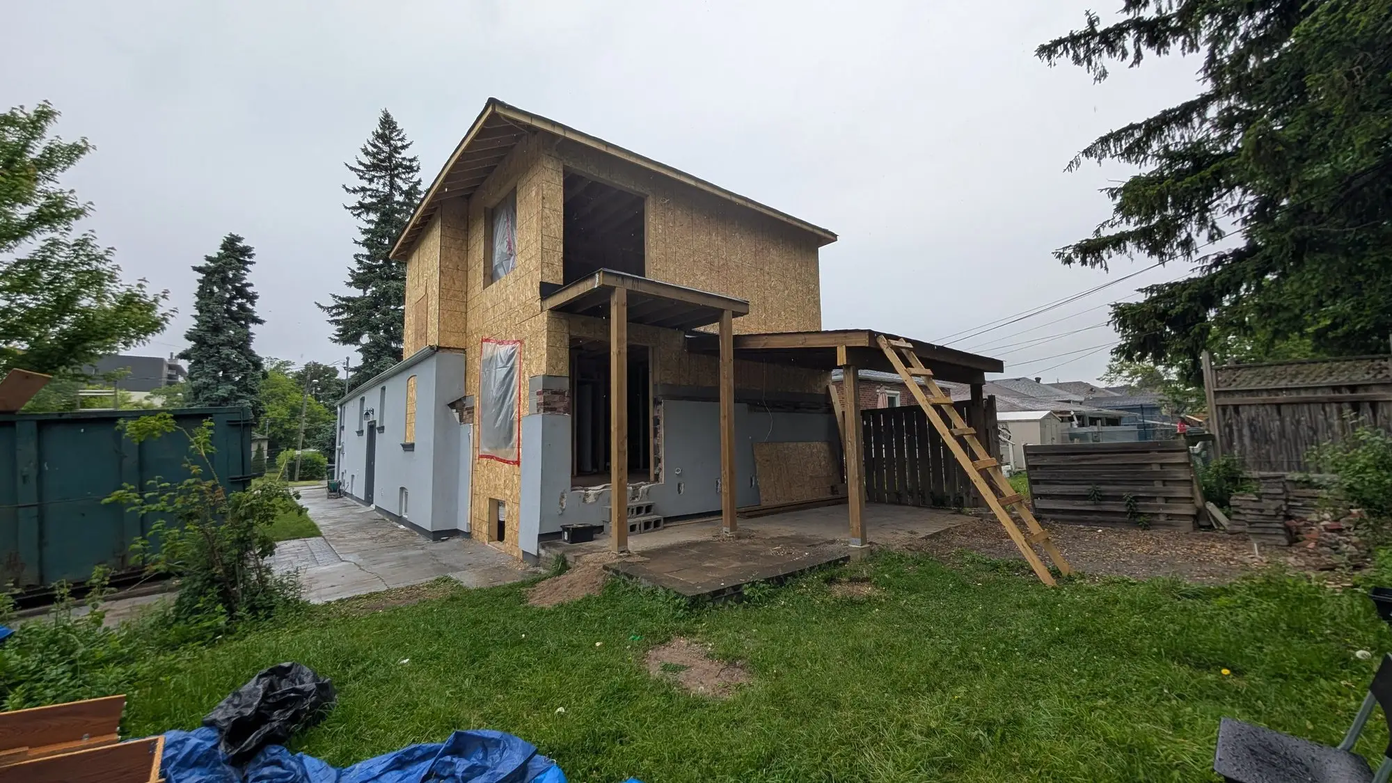 The house standing as a full two storeys in frame