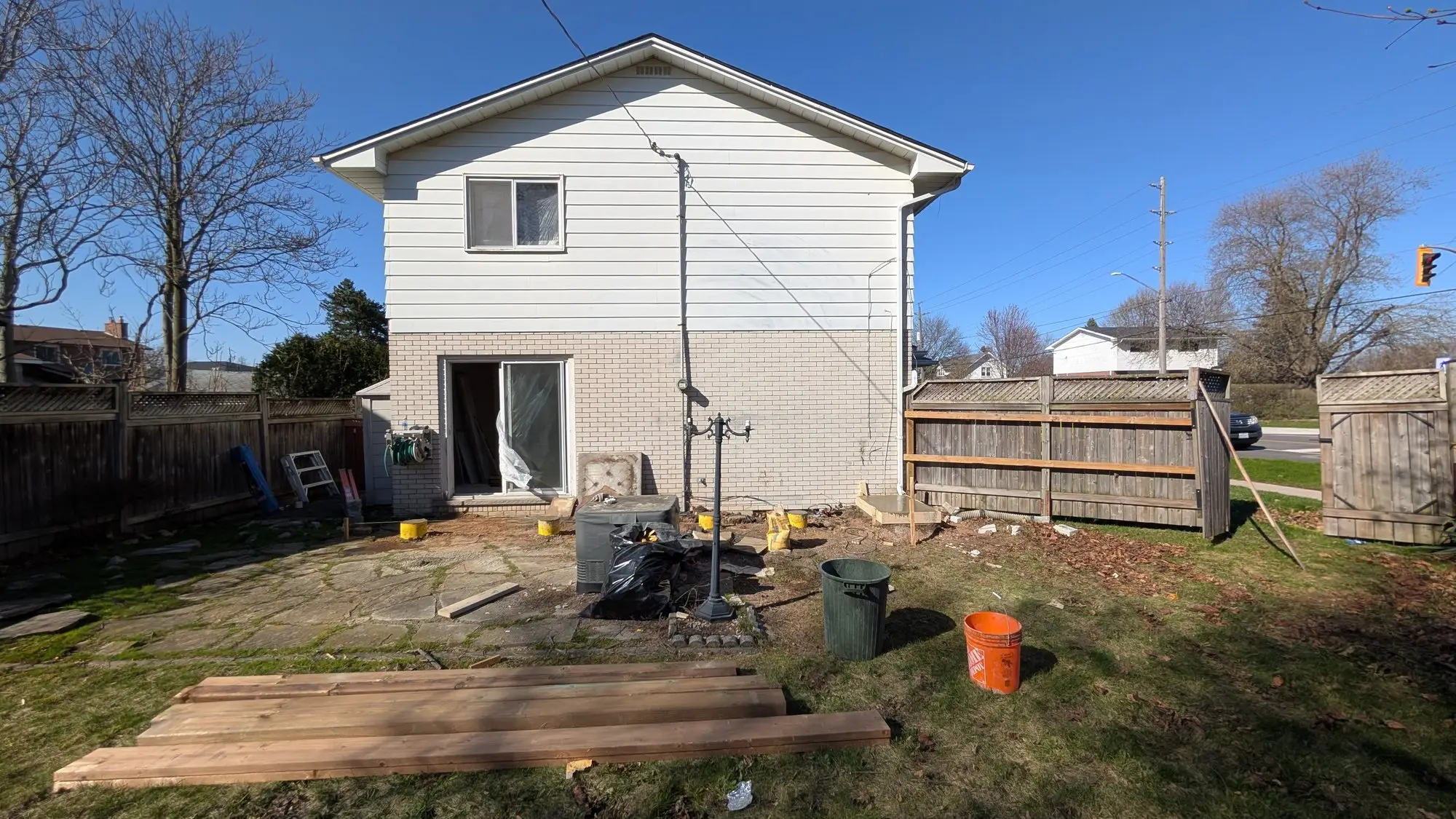Rear of the house during servicing works, with the yard opened up