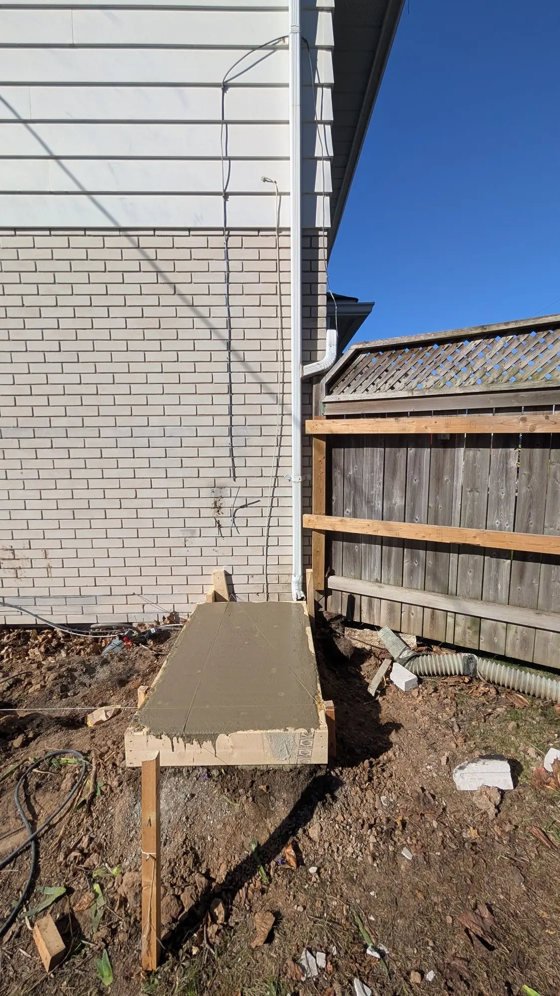 Trench opened alongside the house for the upgraded water service
