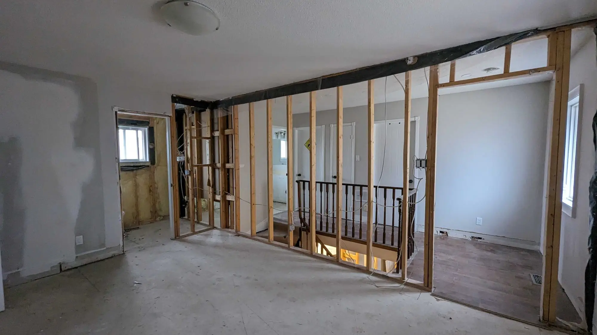 The original staircase kept in place while the surrounding walls were removed