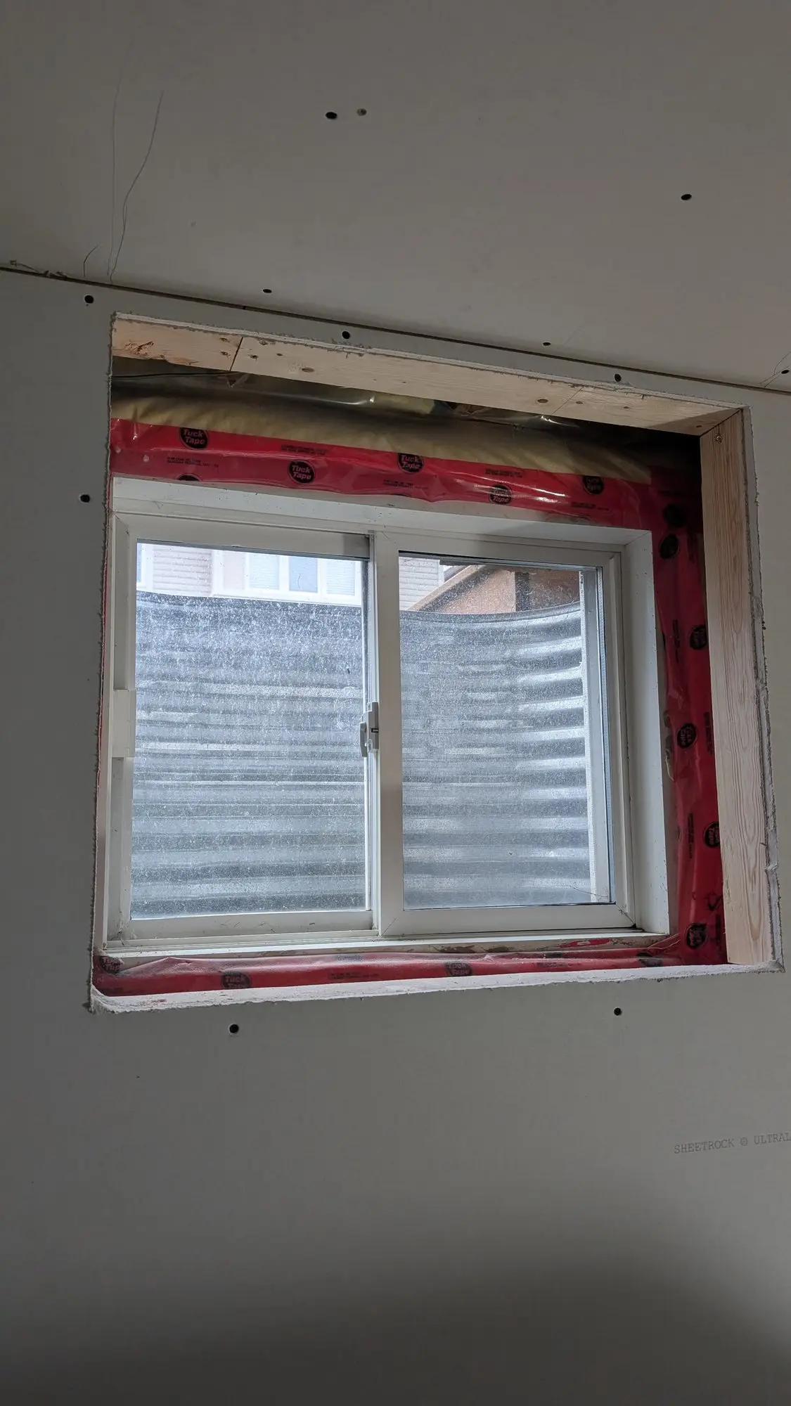 New enlarged basement window bringing daylight into the lower floor