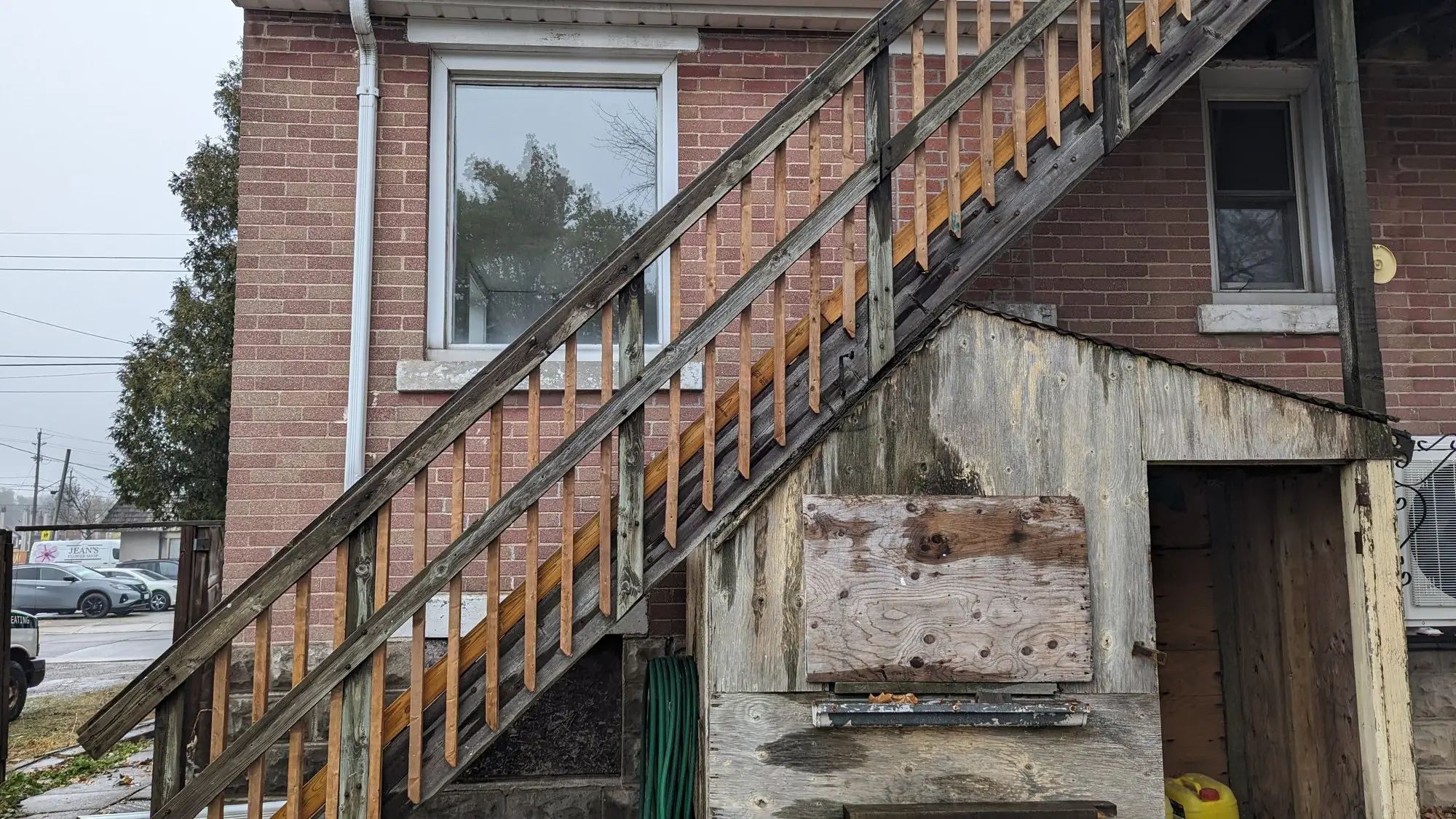 Rear elevation during the build, with the old exterior staircase still in place