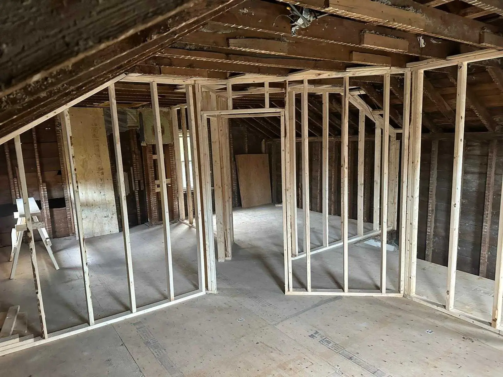 New partition walls dividing the upper floor into rooms