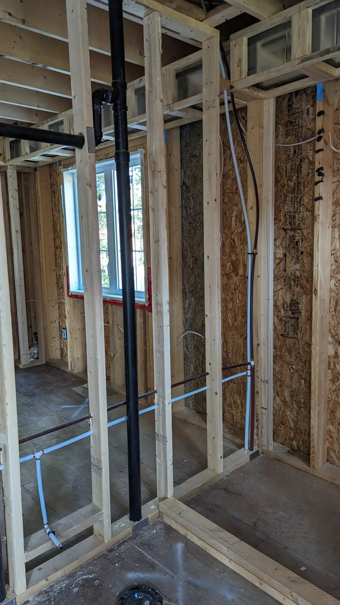 Mechanical and electrical rough-in running through the framed walls