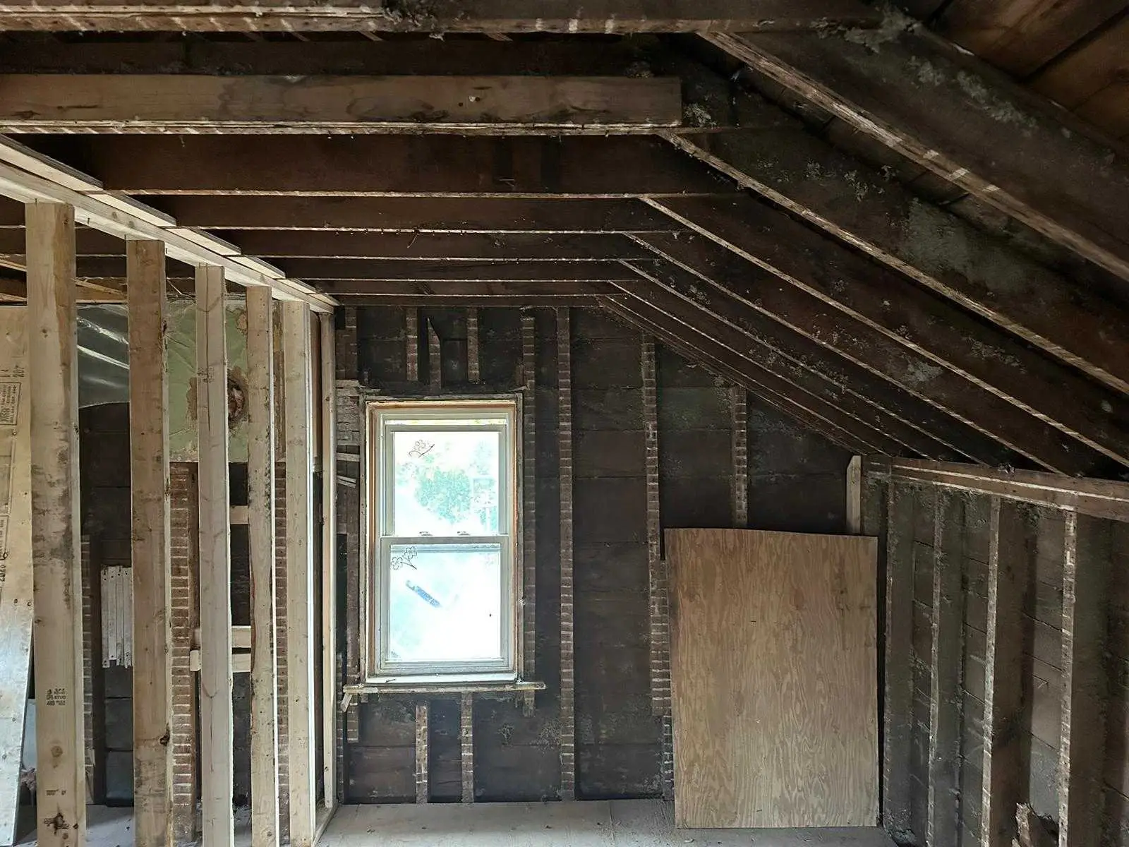 Upper floor framing following the original roof line