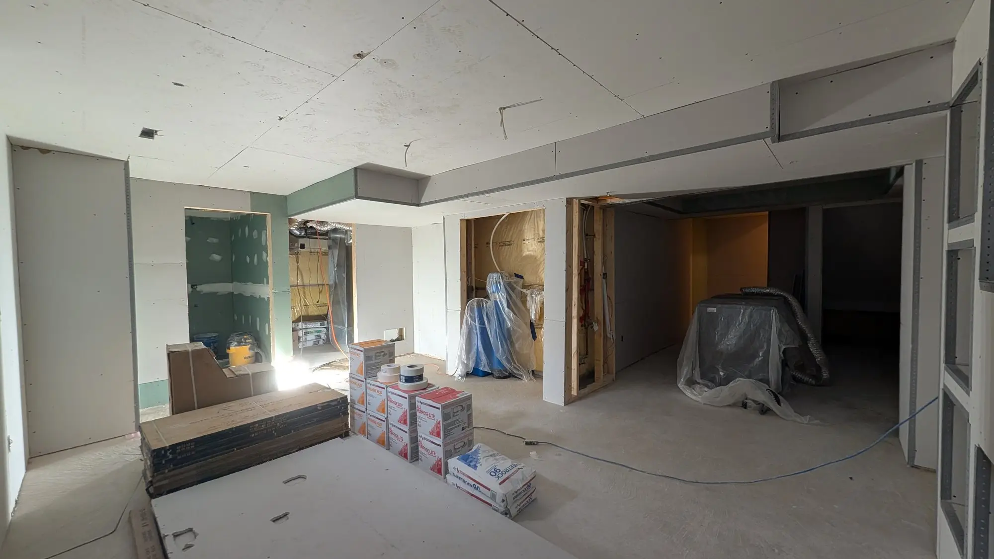 The open rec room area boarded and taped