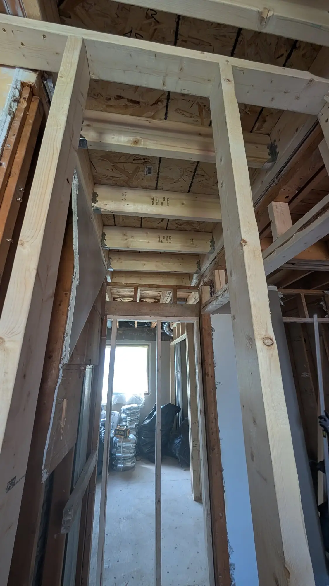 Framed corridor separating the units