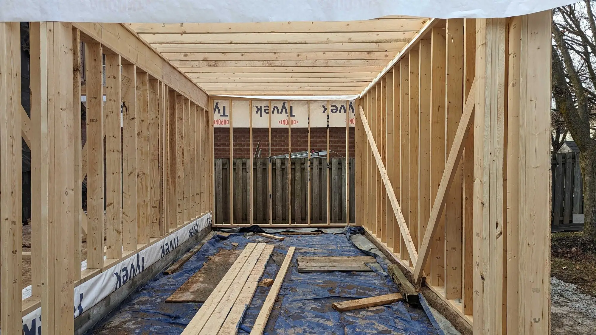 Inside the framed addition, looking through the full length of the new structure