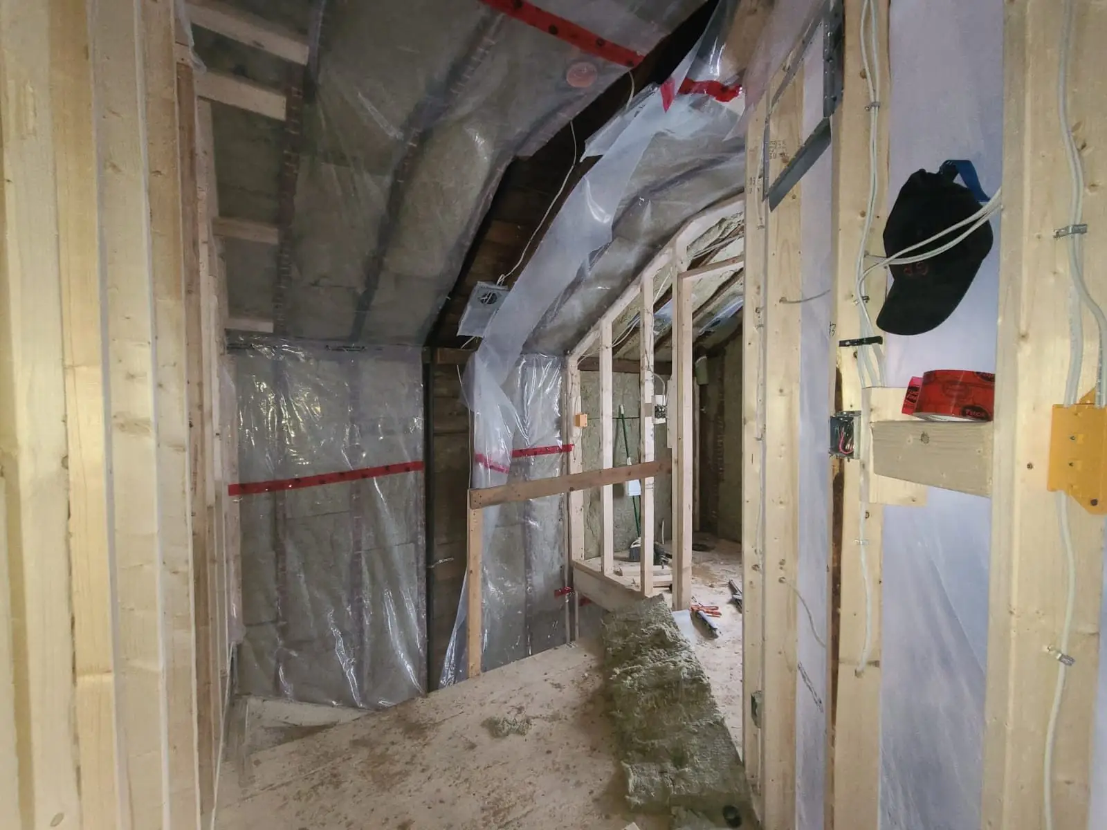 Insulation and taped vapour barrier through the upper floor