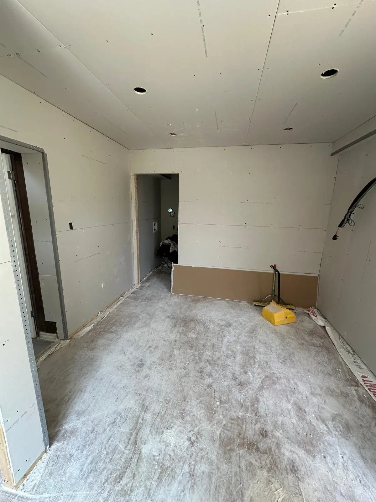 Taped drywall through the upper floor rooms