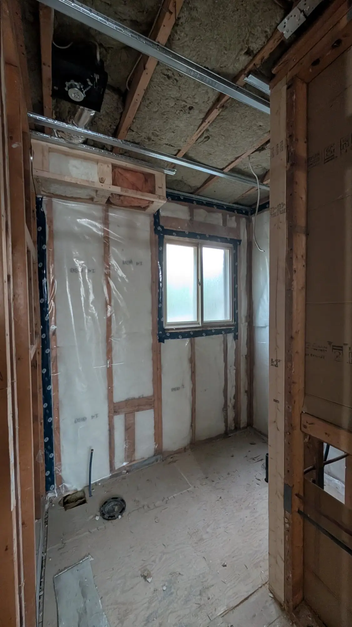 Exterior wall reframed around a window opening