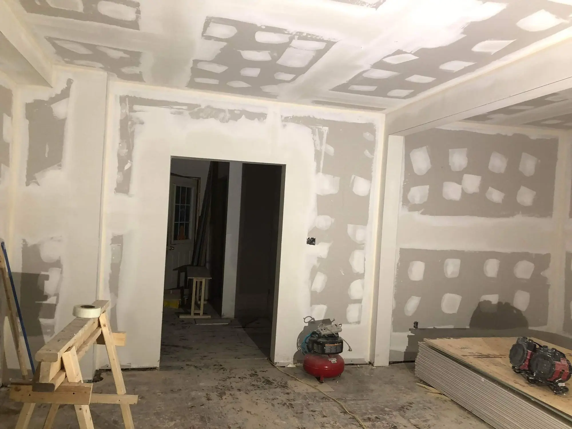 Rooms boarded out with drywall, doorways formed
