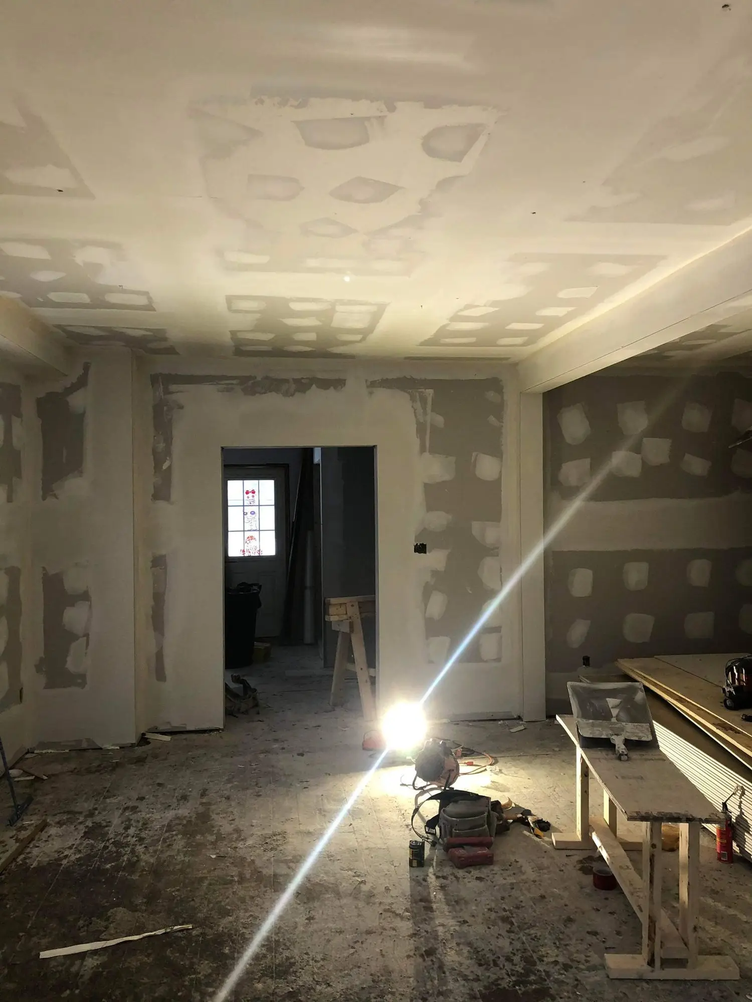 Taped and sanded drywall through the main floor