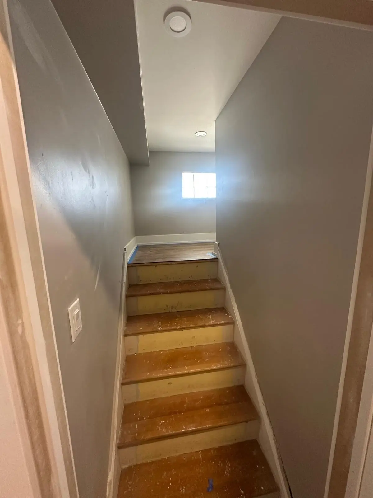 Finished stairs and landing serving the separated upper unit