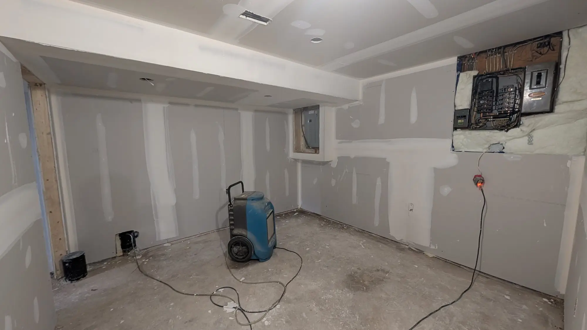 Wide view of a boarded unit before finishing