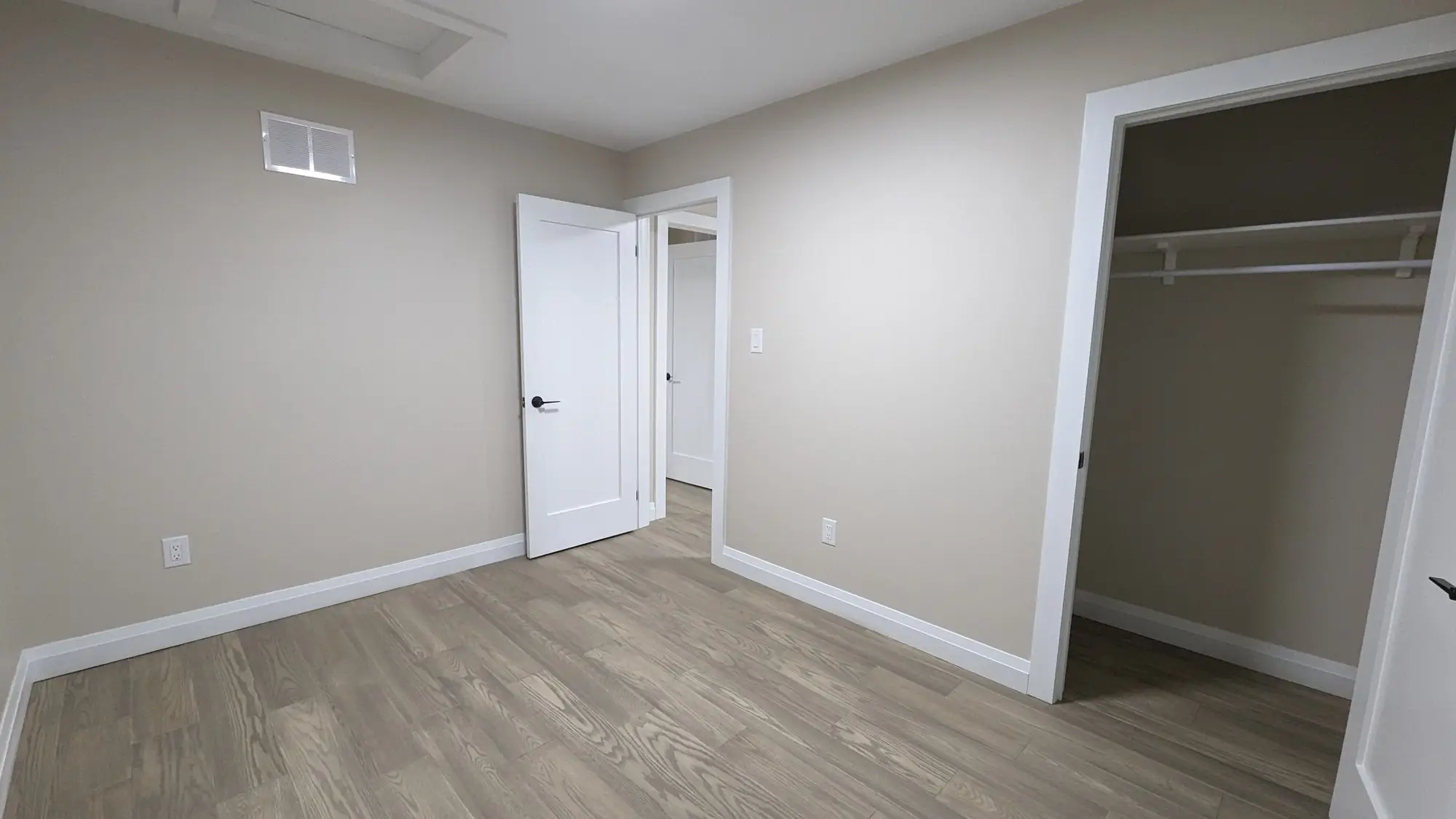Finished interior looking through to the kitchen, flooring and trim complete