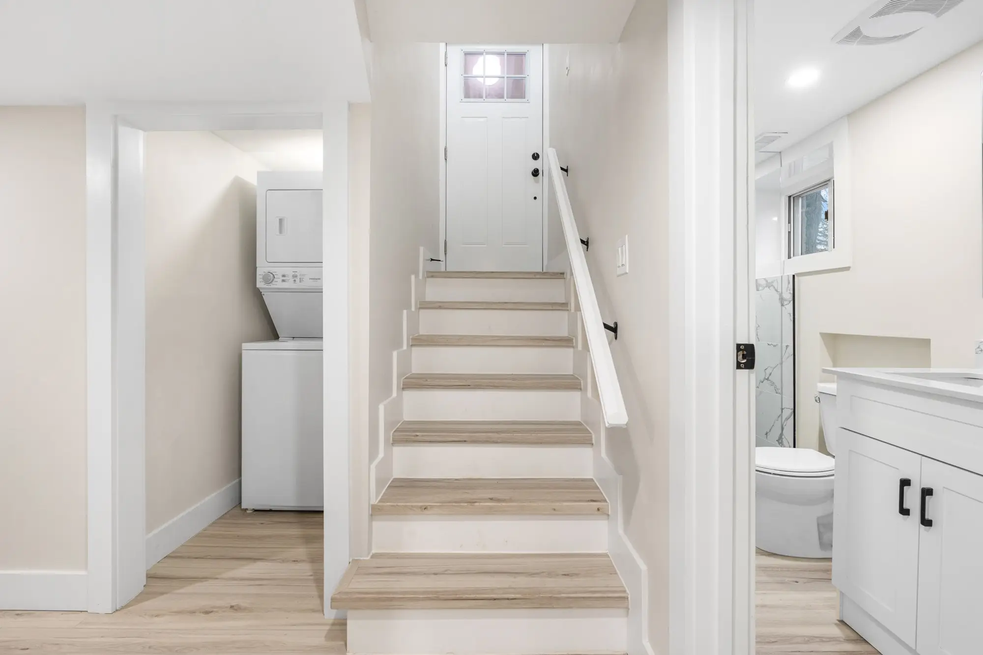 New staircase and landing serving the separated upper unit