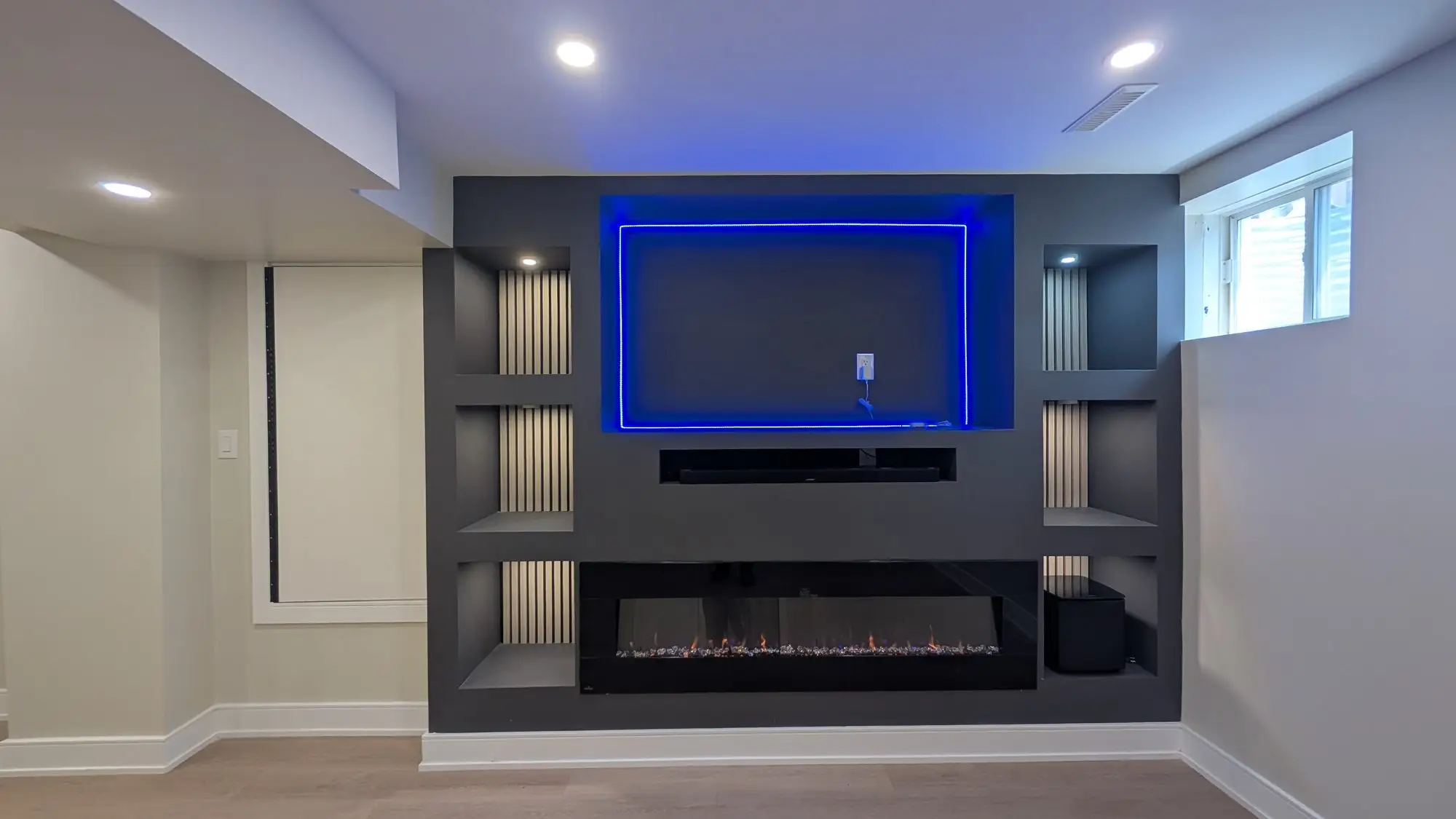 The media wall lit in a different colour, showing the integrated lighting