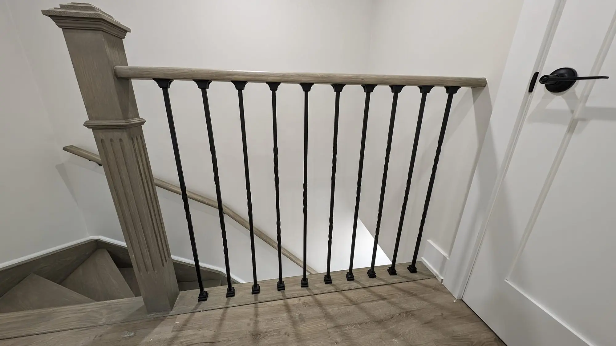 Detail of the new stair rail, square newel post and balusters