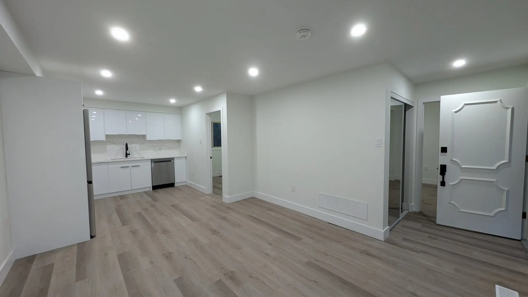 The same lower level finished as a self-contained living space