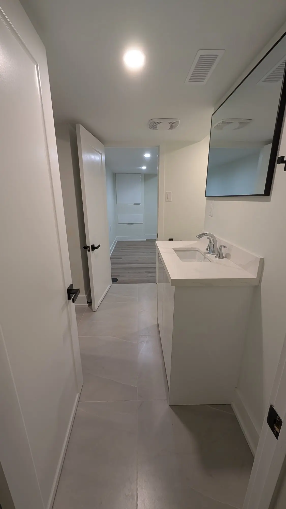 Finished bathroom vanity with mirror and new fixtures